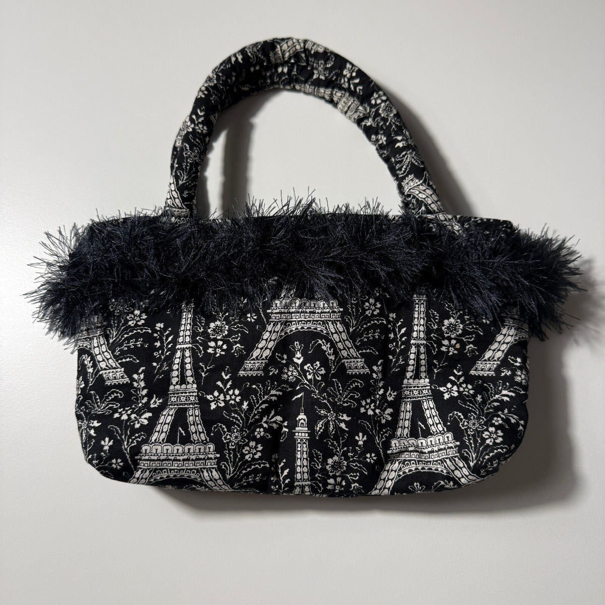Y2K Inspired Black and White Eiffel Tower Print Handbag with Faux Feather Trim
