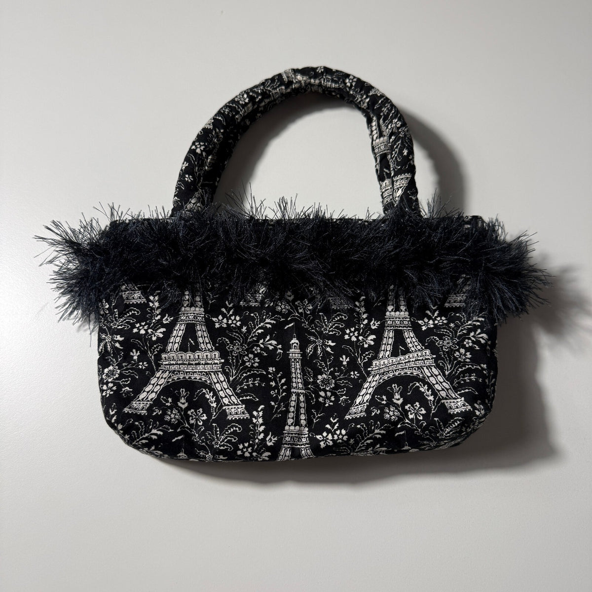 Y2K Inspired Black and White Eiffel Tower Print Handbag with Faux Feather Trim
