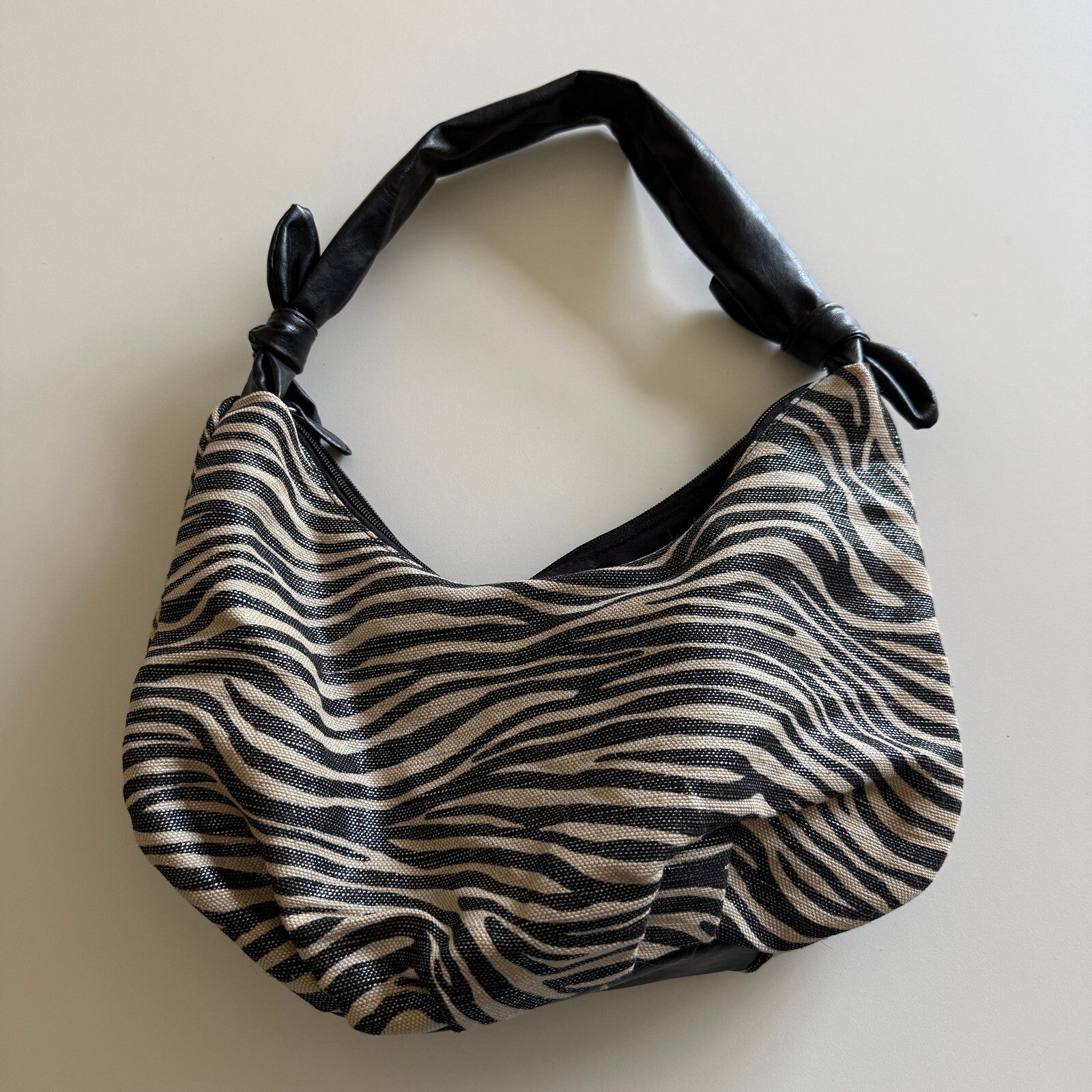 Medium Zebra Print Handbag with Knotted Black Handle