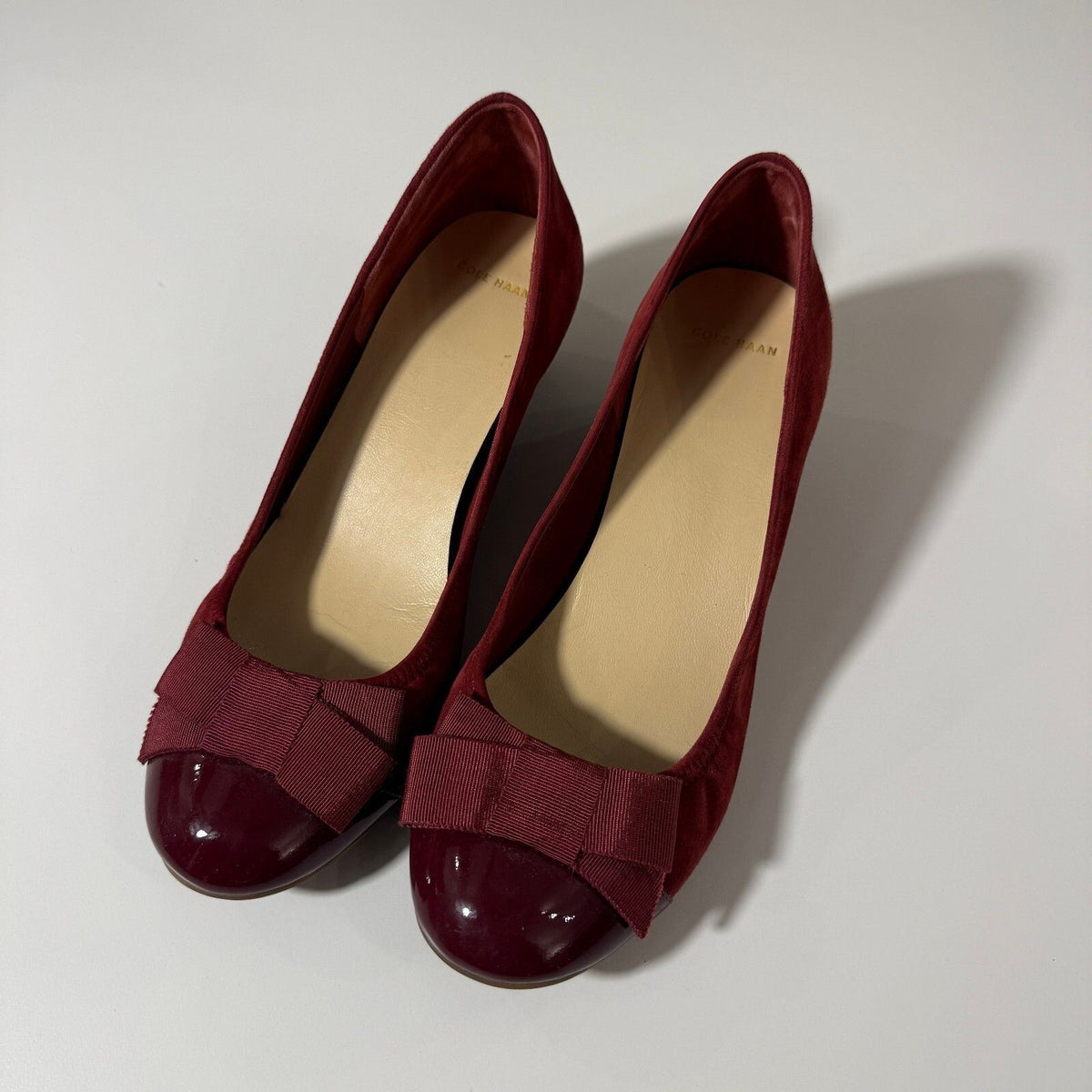 Cole Haan Burgundy Suede Wedge Heels with Bow Accent and Patent Toe Cap